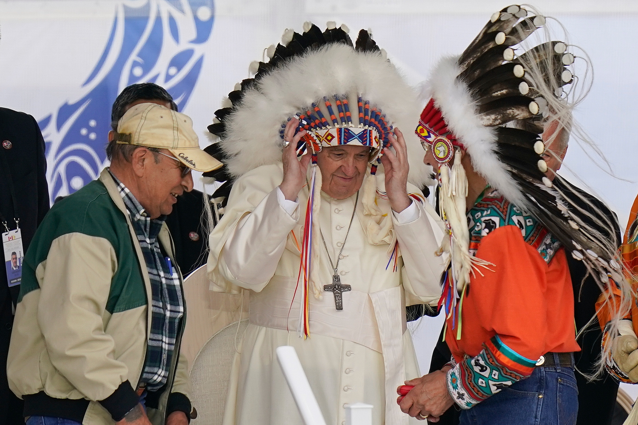 Pope Francis dons a headdress during a visit with Indigenous peoples at the former Ermineskin Residential School in Maskwacis, Alberta, on July 25, 2022. The Vatican on Saturday returned 62 artifacts to Indigenous peoples from Canada.